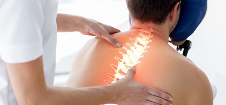 A patient with osteochondrosis being examined by a doctor