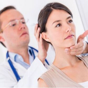 The neurologist examines a patient who has neck pain